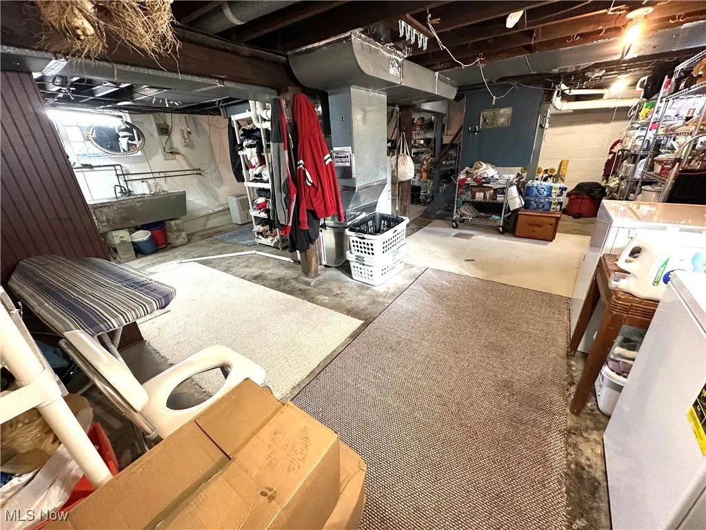 Unfinished below grade area with heating unit