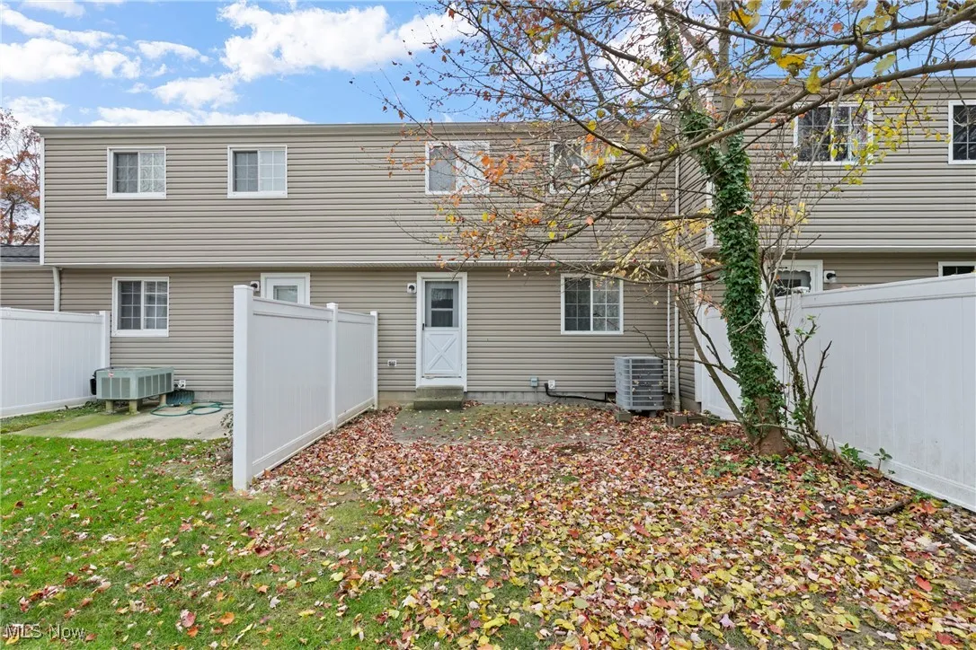 Behind condo and exiting out of kitchen