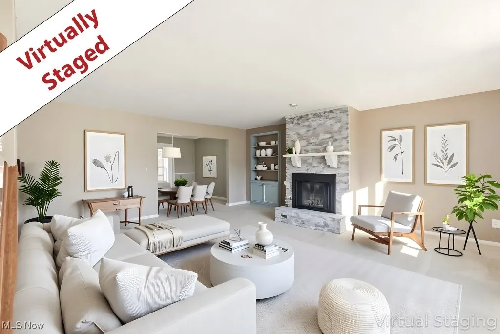 Living room with a stone fireplace, carpet flooring, and built in features