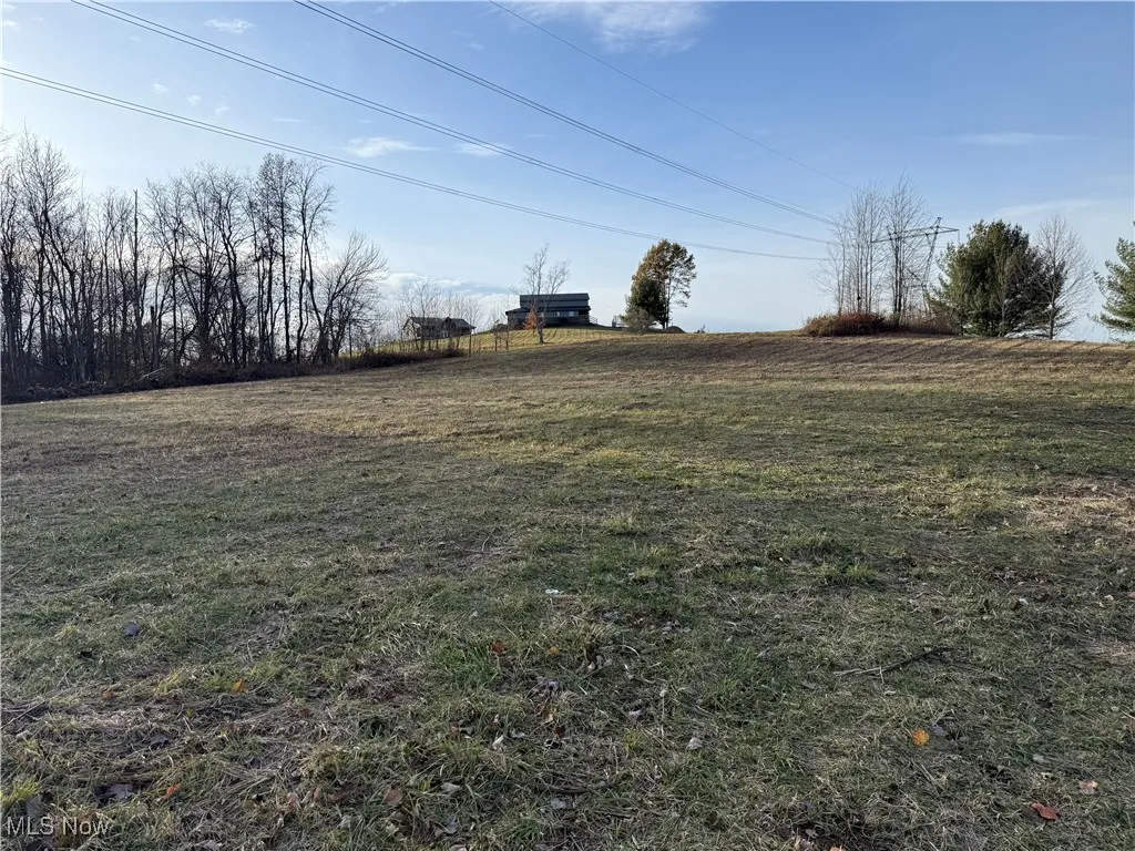 View of green lawn with a view of rural / pastoral area