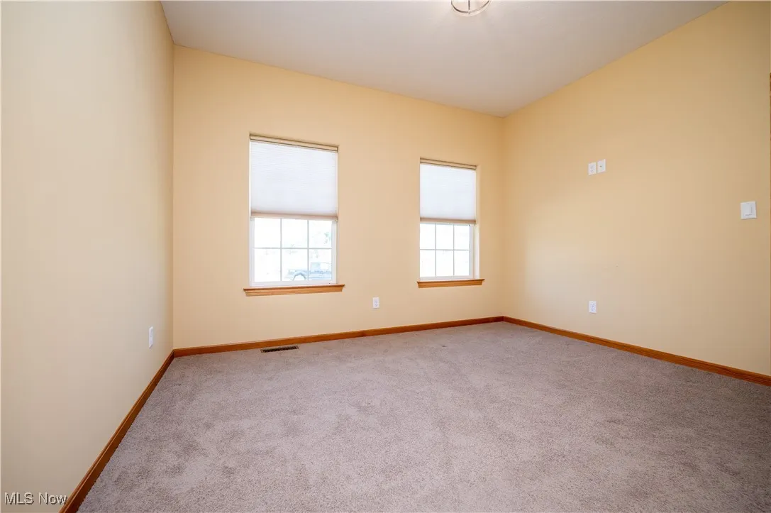  featuring light carpet and baseboards