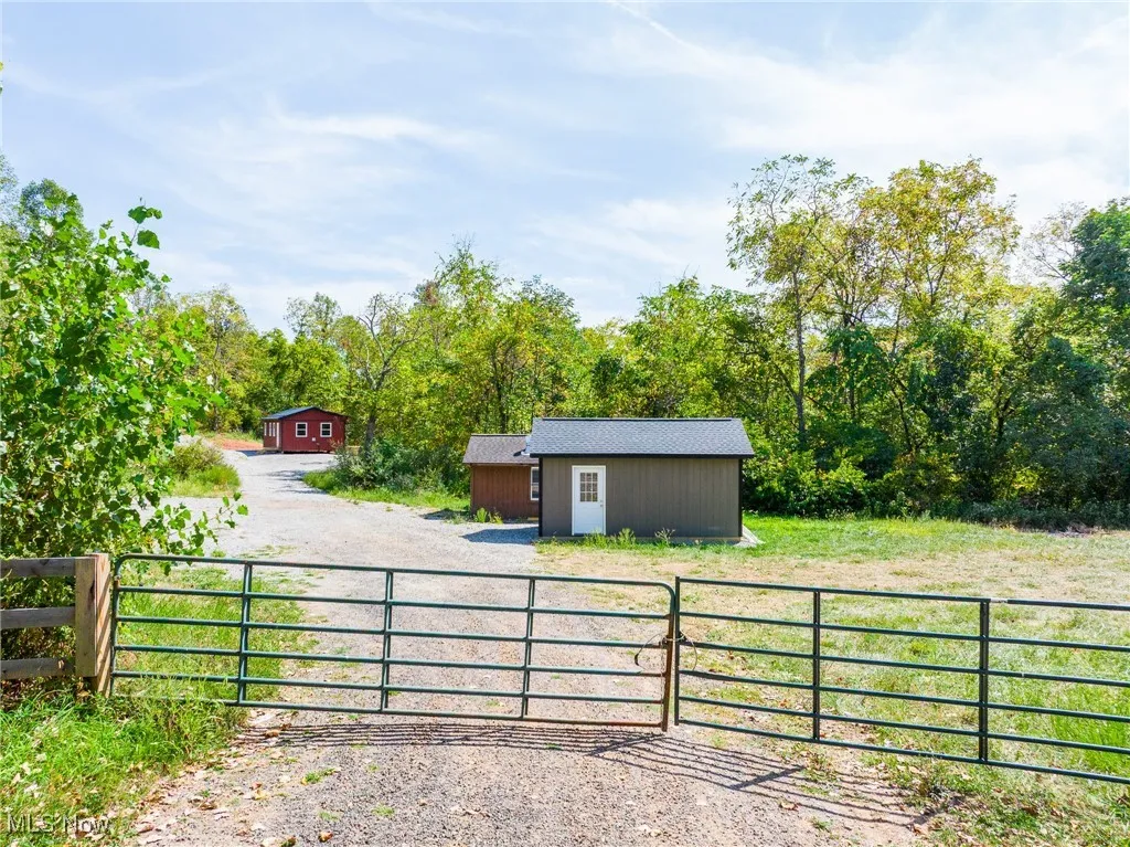 Gate with an outbuilding