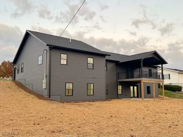 Rear view of property featuring a patio