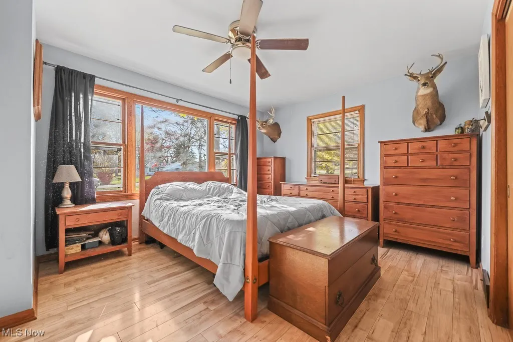 Bedroom featuring a ceiling fan and light wood-type flooring