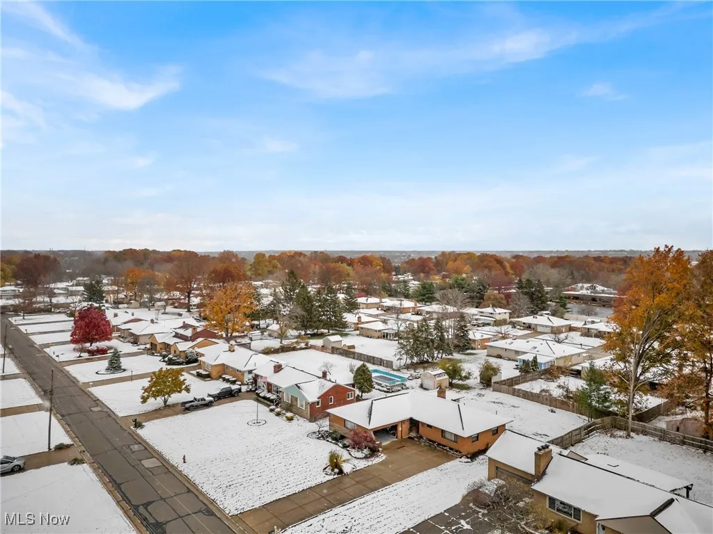 Snowy aerial view with a residential view
