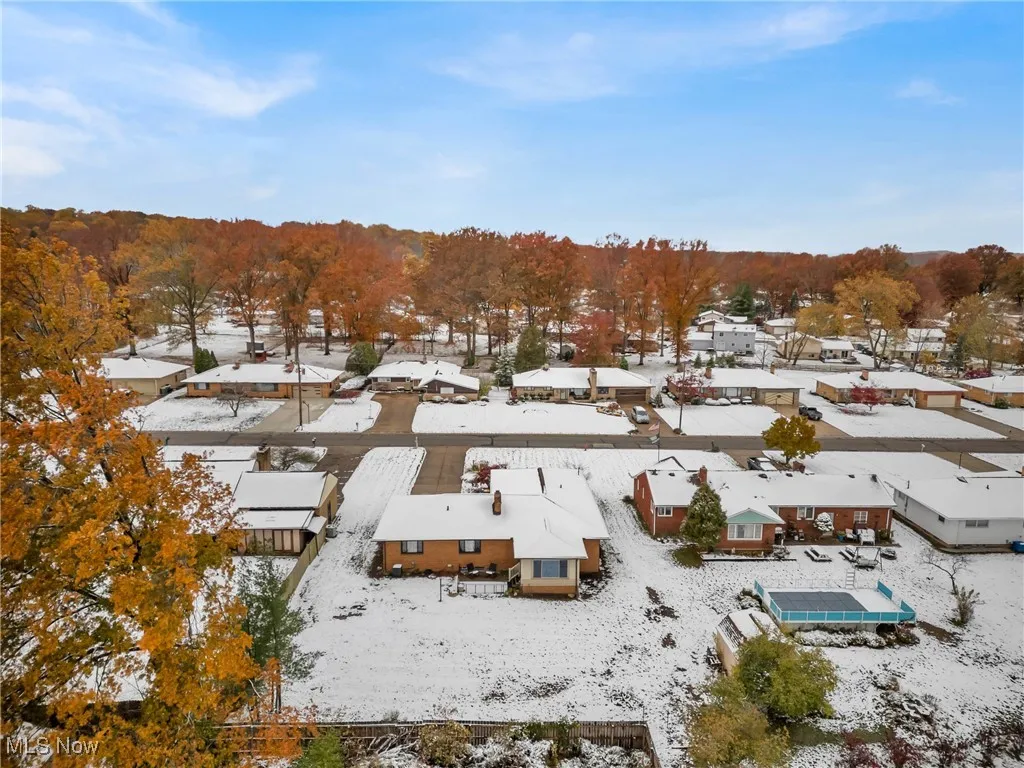 Snowy aerial view with a residential view