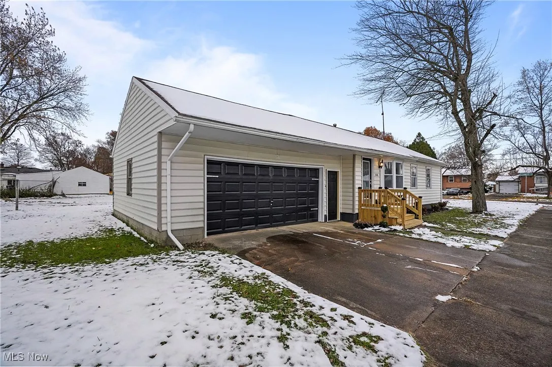 View of front facade featuring a garage