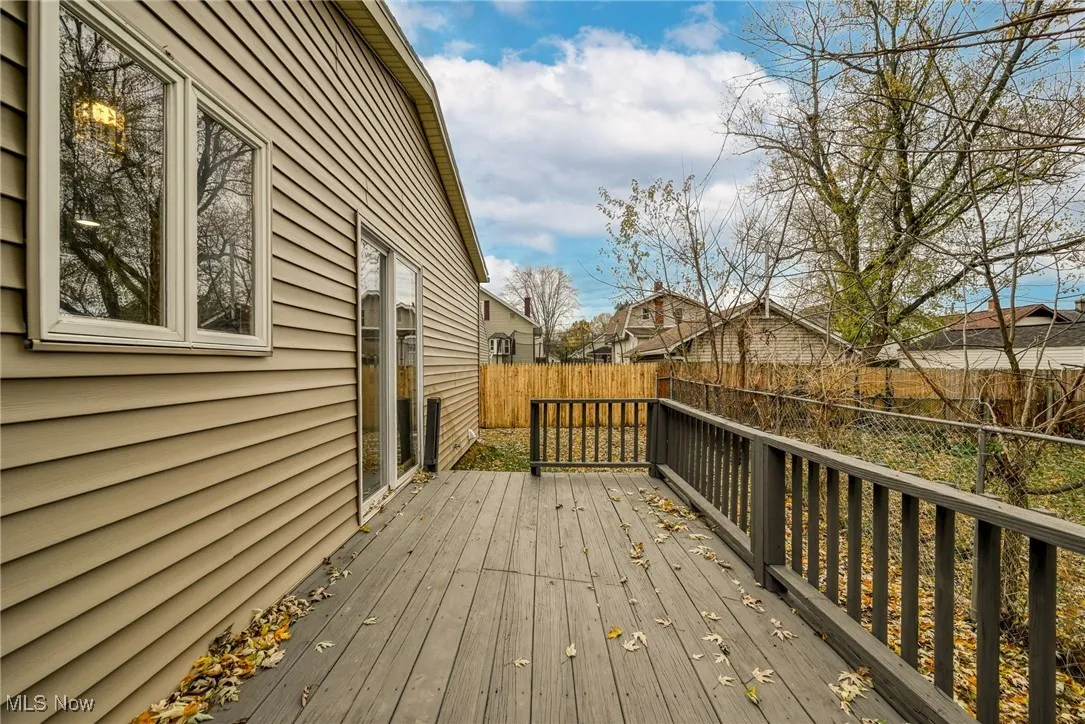 Wooden deck featuring a fenced backyard