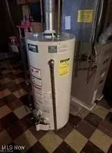 Utility room featuring gas water heater