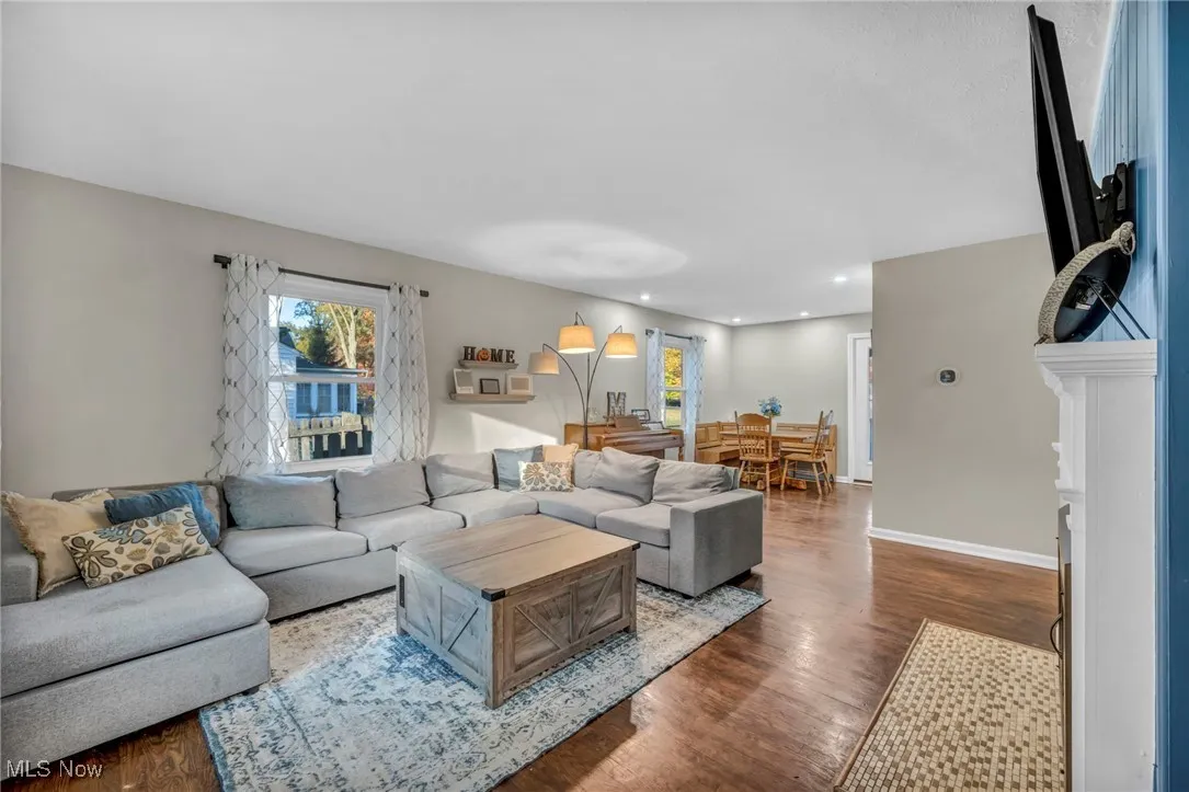 Living area featuring wood finished floors and baseboards
