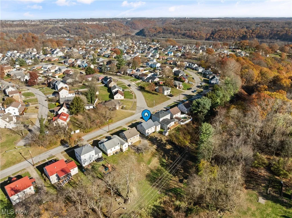 View of property location with nearby suburban area