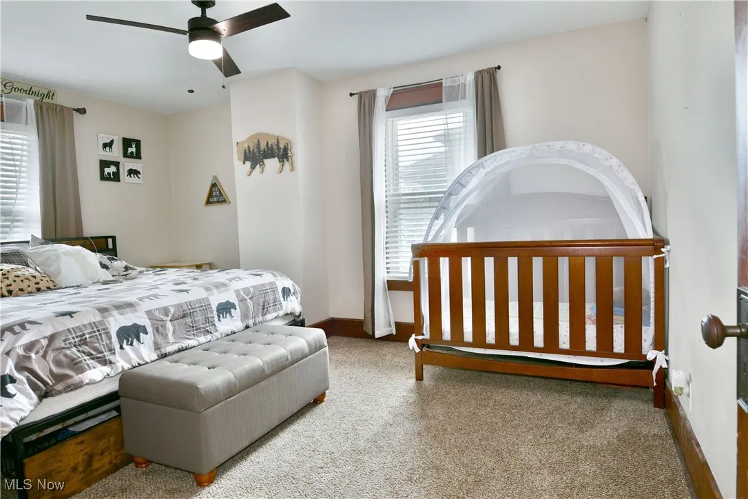 Bedroom featuring carpet floors and ceiling fan