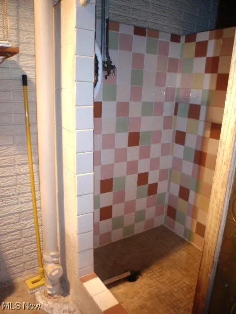 Bathroom featuring a shower stall