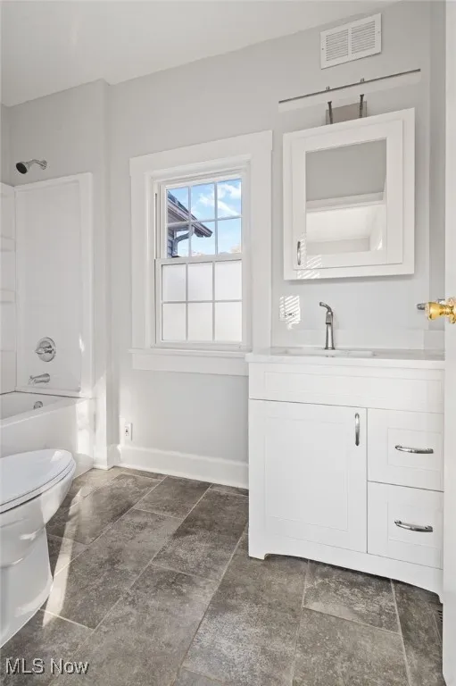 Bathroom featuring vanity and shower / bath combination
