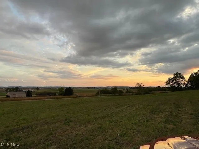 View of green lawn with a view of rural / pastoral area