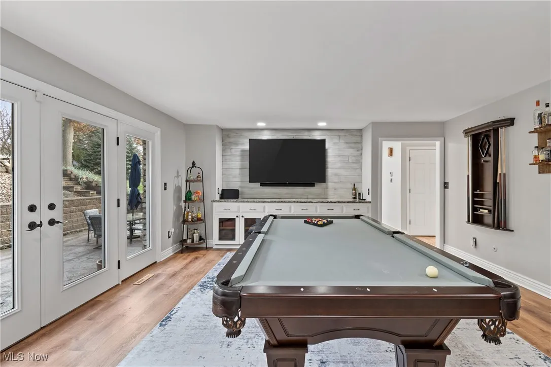 Recreation room featuring pool table, light wood-type flooring, french doors, and recessed lighting