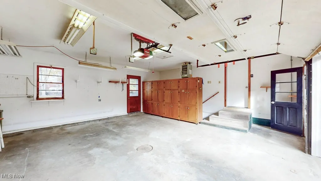 Garage with a garage door opener and heater.