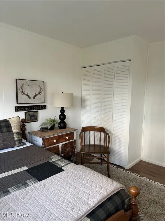 Bedroom #3  featuring ornamental molding, a closet, and Luxury Vinyl floors