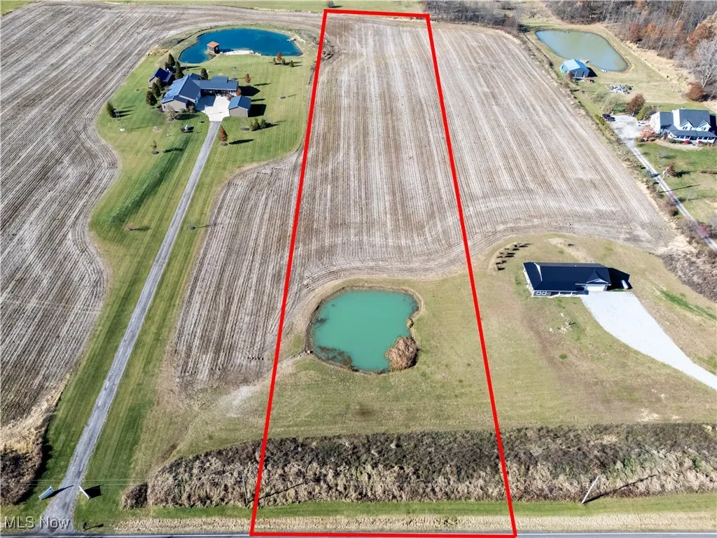 View of property location with a nearby body of water and property boundaries highlighted