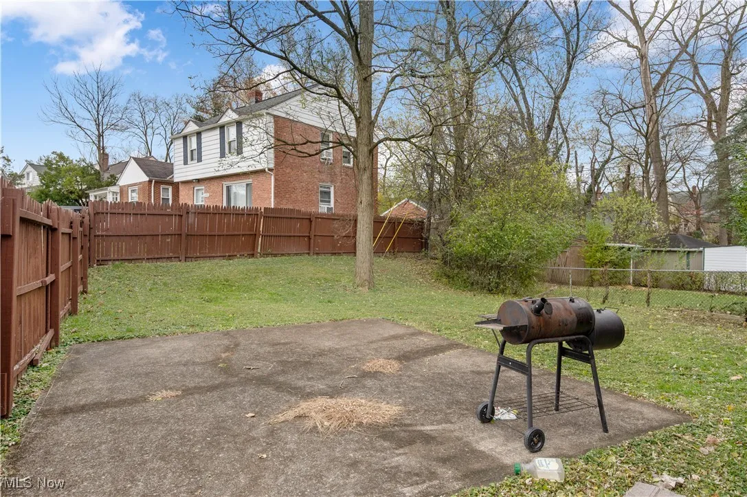 Fenced backyard featuring a patio