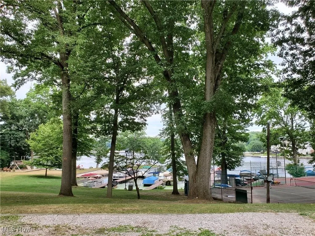 View of car parking featuring a water view