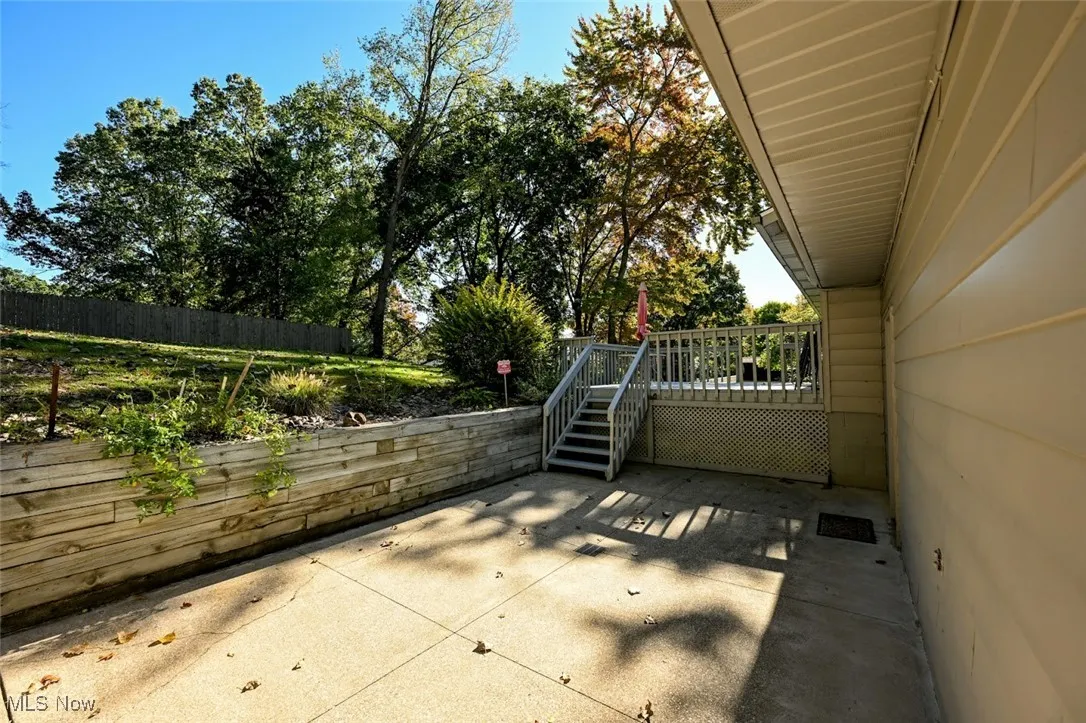 View of patio with a deck and stairs