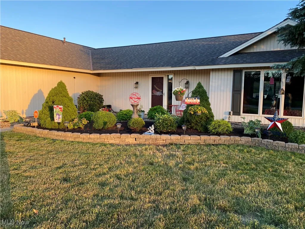 View of front of home with summer flowers​​‌​​​​‌​​‌‌​‌‌​​​‌‌​‌​‌​‌​​​‌​​ blooming