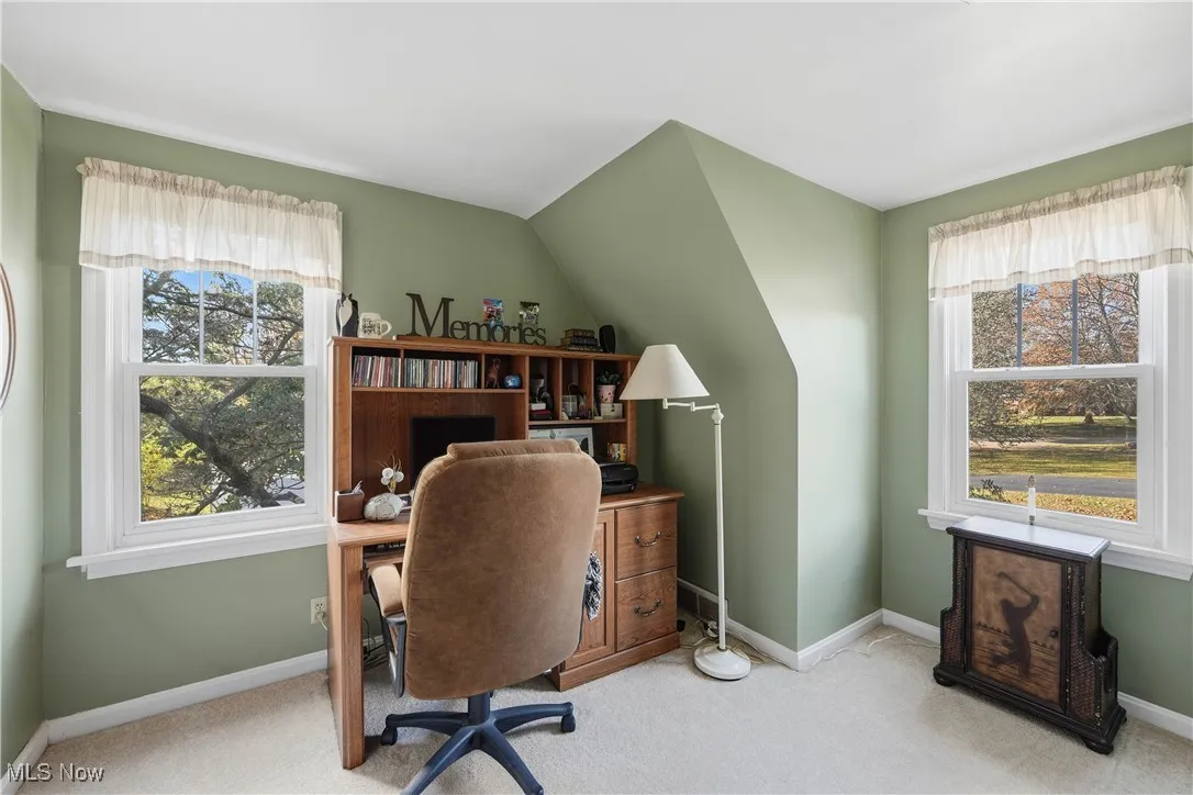 Office featuring light carpet and baseboards