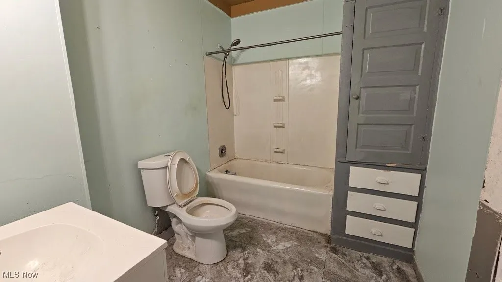 Full bathroom featuring bathtub / shower combination and vanity