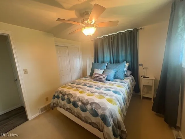Washroom with concrete floors and separate washer and dryer