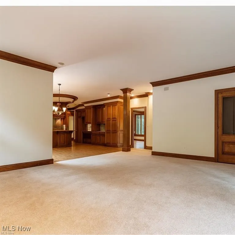 The expansive great room opens effortlessly to the kitchen, offering plenty of space to relax, gather, and enjoy an easy, connected lifestyle