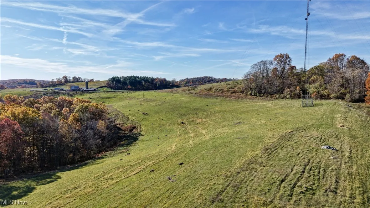 View of green lawn with a view of countryside