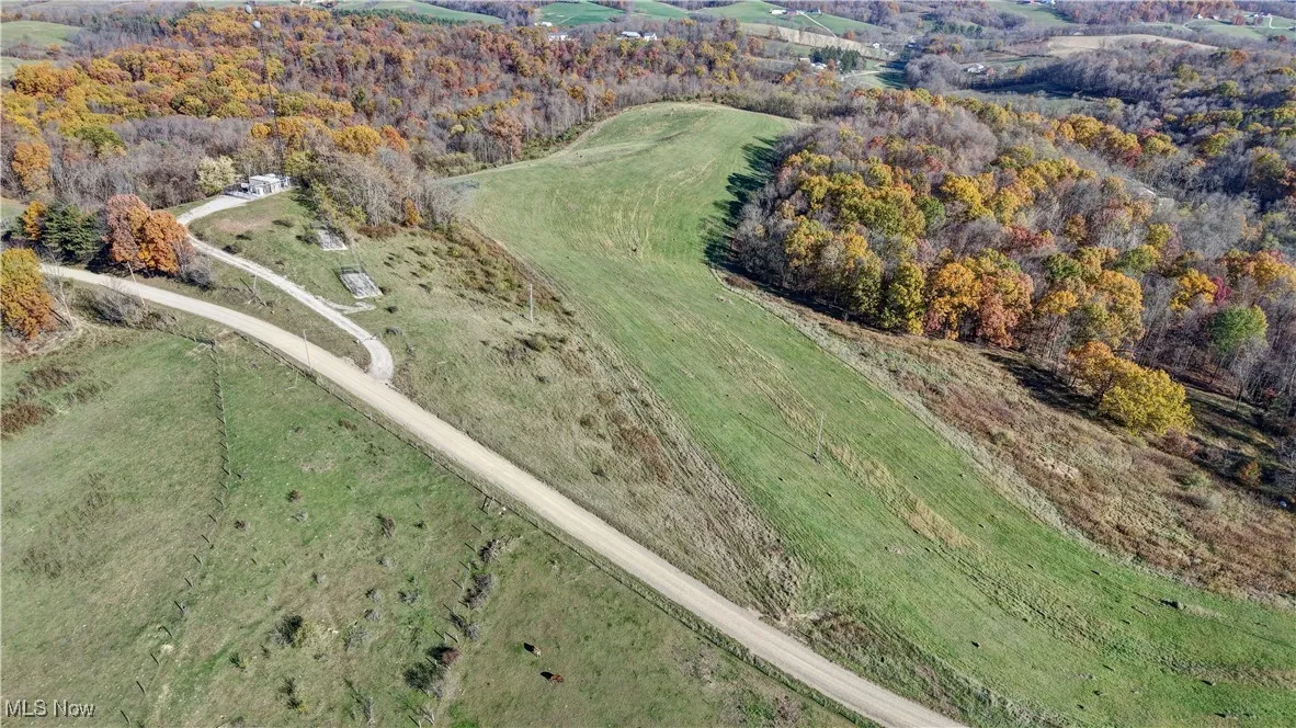 View of property location featuring a heavily wooded area