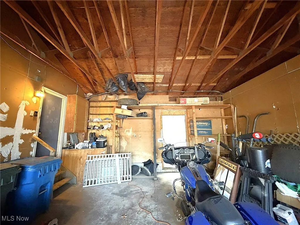 Miscellaneous room featuring a garage and concrete flooring