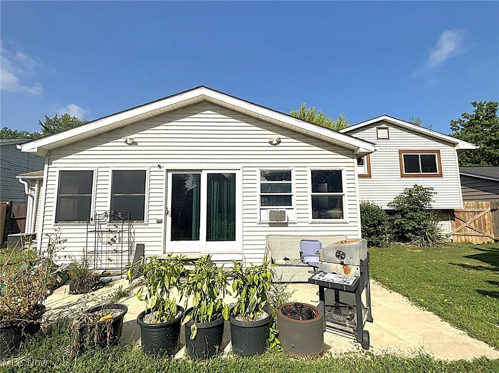 Rear view of house with a patio area