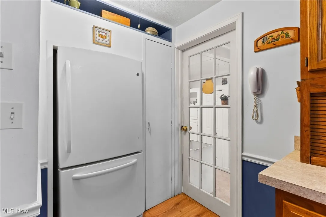 Doorway featuring wood finished floors