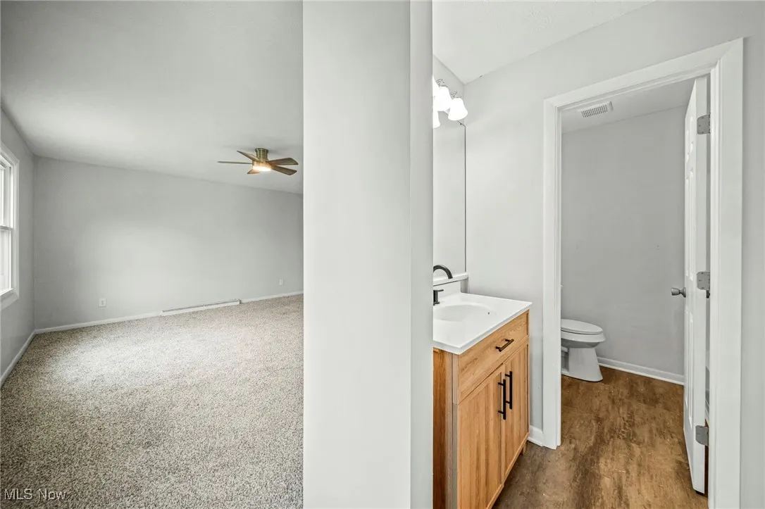 Bathroom with vanity and a ceiling fan