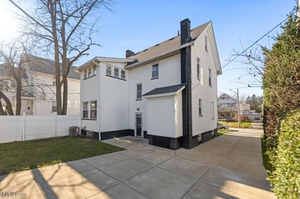 Back of property with a chimney