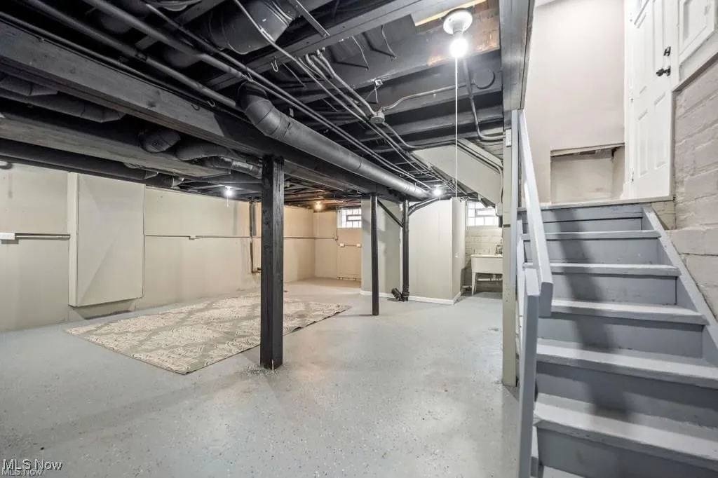 Basement featuring stairway
