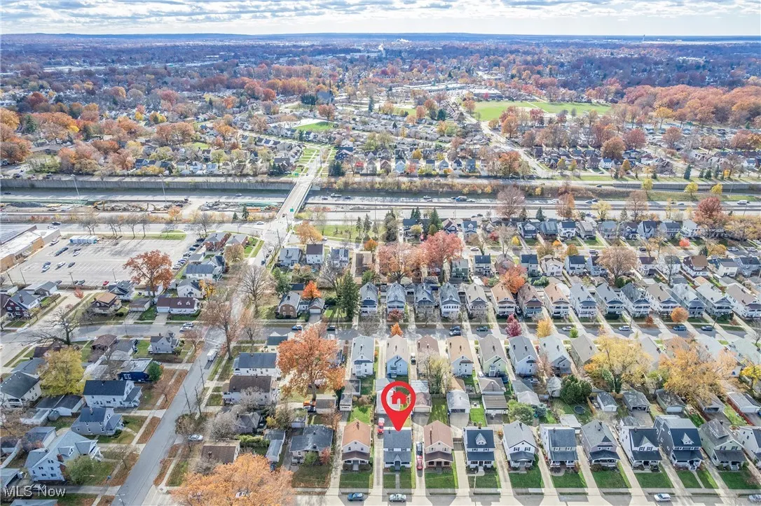 Aerial overview of property's location with nearby suburban area