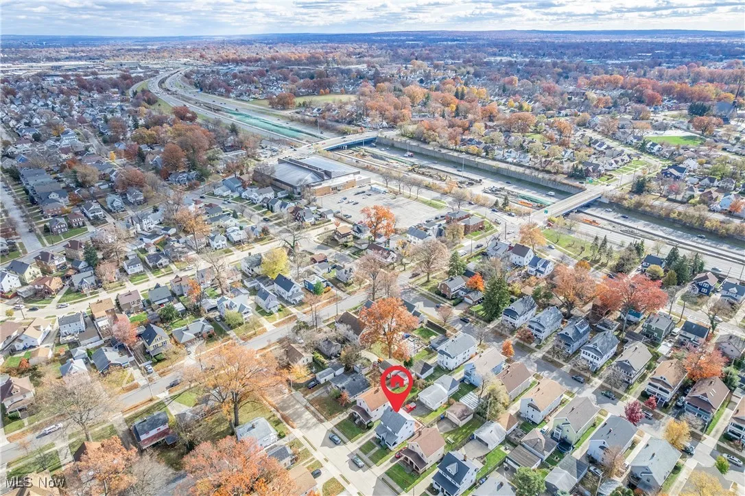 Aerial overview of property's location featuring nearby suburban area