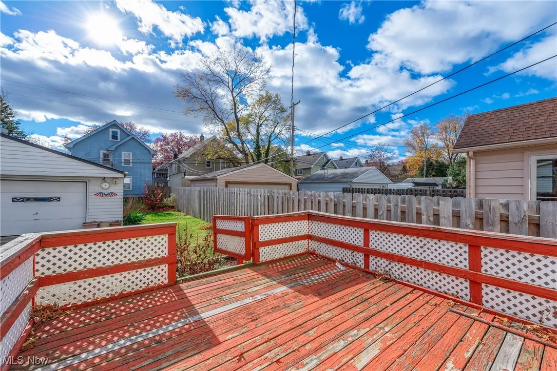 Deck featuring a residential view and an outbuilding