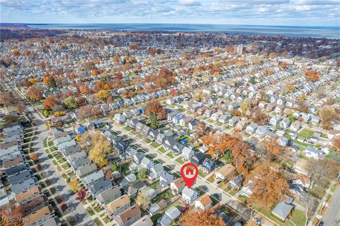 Aerial view of property's location featuring nearby suburban area