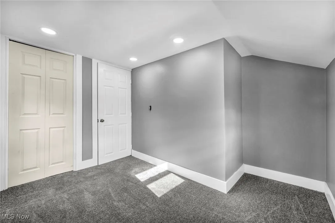 Unfurnished bedroom with carpet floors, recessed lighting, and a closet
