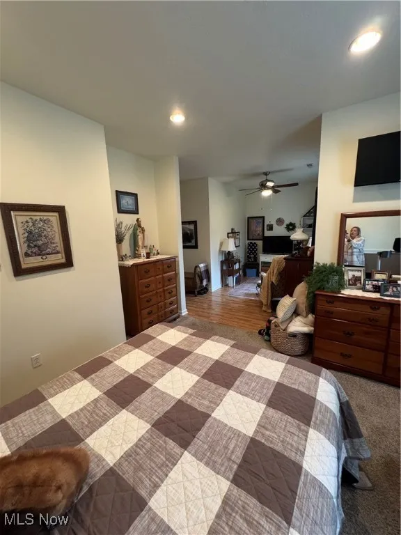 Bedroom with recessed lighting, wood finished floors, and a ceiling fan