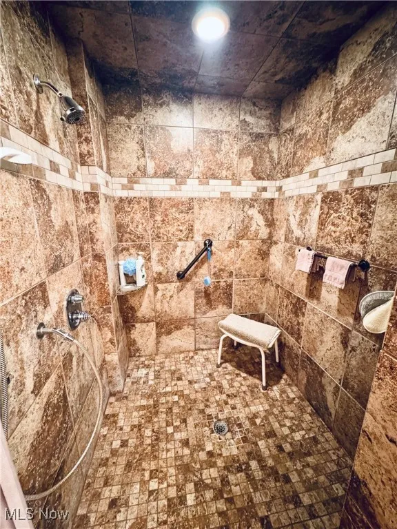 Bathroom with a tile shower