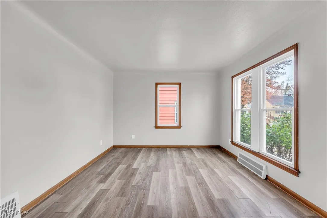 Empty room with light wood-style floors and​​‌​​​​‌​​‌‌​‌‌​​​‌‌​‌​‌​‌​​​‌​​ baseboards