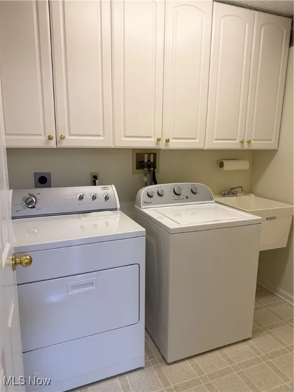 Laundry with cabinet space and washer, dryer, utility tub