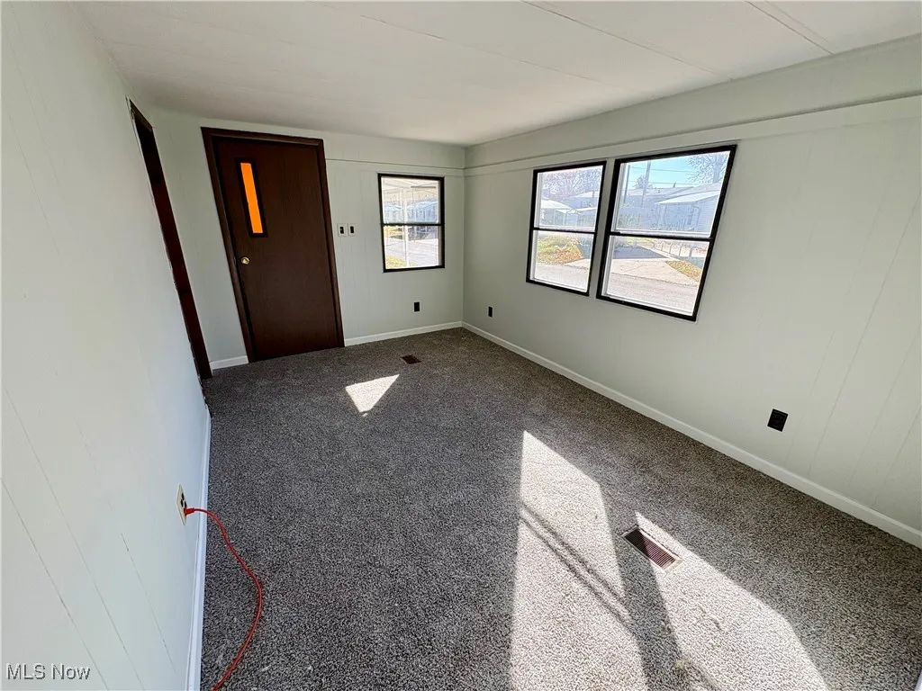 Unfurnished bedroom featuring carpet