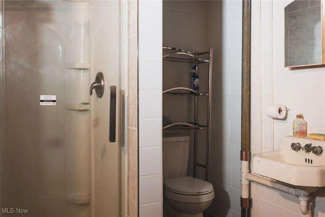 Bathroom featuring a sink and a stall shower